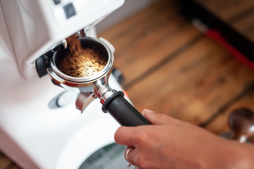 espresso grinding into portafilter